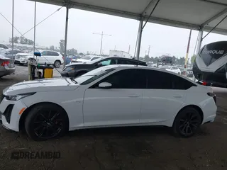 2021 Cadillac CT5 Sport z VIN 1G6DU5RK9M0117981, wystawiony jako IAAI lot #42021432 z przebiegiem 67 363 mil mil oraz . Historia ofert i sprzedaży dostępna na DreamBid. Obrazek 14.