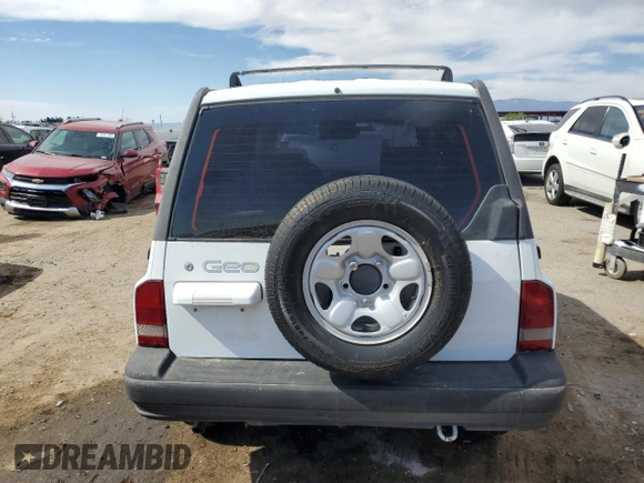 1996 Geo Tracker z VIN 2CNBE1364T6909947, wystawiony jako Copart lot #54411835 z przebiegiem 171 862 mil mil oraz Szkoda całkowita • Salvage title. Historia ofert i sprzedaży dostępna na DreamBid. Obrazek 6.