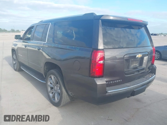 2018 Chevrolet Suburban Premier with VIN 1GNSCJKC5JR135265, listed as a IAAI auction lot 42028935 with 136,382 mi miles and . Bid and sale history available at DreamBid. Image 3.