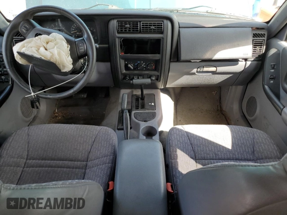 1998 Jeep Cherokee Sport z VIN 1J4FJ68S4WL101110, wystawiony jako Copart lot #57696755 z przebiegiem 218 254 mil mil oraz Szkoda całkowita • Salvage title. Historia ofert i sprzedaży dostępna na DreamBid. Obrazek 8.