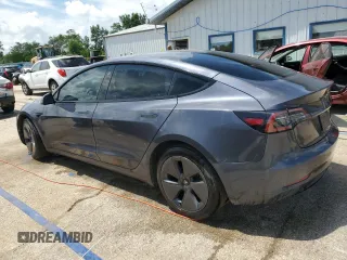 2023 Tesla Model 3 with VIN 5YJ3E1EA4PF614129, listed as a Copart auction lot 62019385 with 23,218 mi miles and Salvage title. Bid and sale history available at DreamBid. Image 2.