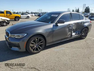 2019 BMW 3 Series 330i with VIN WBA5R1C57KFH22056, listed as a Copart auction lot 49896985 with 58,311 mi miles and Salvage title. Bid and sale history available at DreamBid. Image 1.