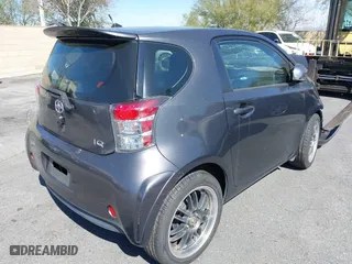 2012 Scion iQ with VIN JTNJJXB07CJ017296, listed as a IAAI auction lot 41636769 with 94,333 mi miles. Bid and sale history available at carsss.com. Image 4.