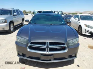 2014 Dodge Charger SXT z VIN 2C3CDXHG3EH339404, wystawiony jako IAAI lot #42072957 z przebiegiem 125 183 mil mil oraz . Historia ofert i sprzedaży dostępna na DreamBid. Obrazek 13.