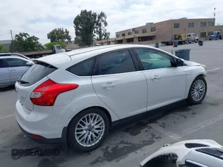 2014 Ford Focus Titanium with VIN 1FADP3N24EL186050, listed as a IAAI auction lot 42481684 with 187,687 mi miles and . Bid and sale history available at DreamBid. Image 4.