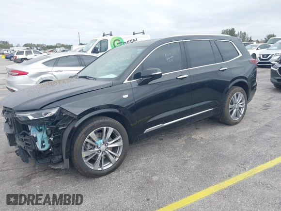 2023 Cadillac XT6 FWD Premium Luxury with VIN 1GYKPCRS6PZ106284, listed as a IAAI auction lot 41595617 with 32,795 mi miles and . Bid and sale history available at DreamBid. Image 2.