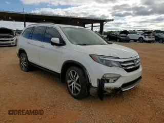 2017 Honda Pilot Touring z VIN 5FNYF6H92HB067140, wystawiony jako Copart lot #72200584 z przebiegiem 127 856 mil mil oraz Szkoda całkowita • Salvage title. Historia ofert i sprzedaży dostępna na DreamBid. Obrazek 11.