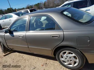 1999 Mazda 626 LX with VIN 1YVGF22D8X5871485, listed as a IAAI auction lot 41641049 with 115,603 mi miles. Bid and sale history available at carsss.com. Image 14.
