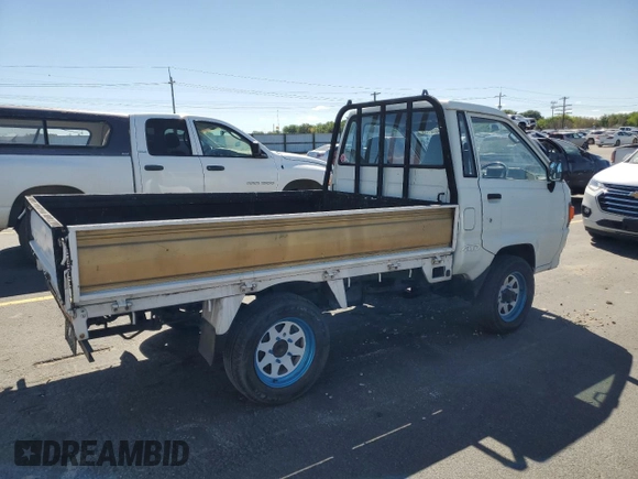 1994 Toyota Tacoma with VIN CM600012981, listed as a Copart auction lot 64052155 with 237,536 mi miles and Salvage title. Bid and sale history available at DreamBid. Image 3.