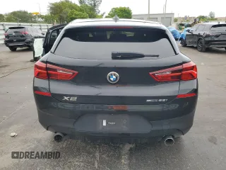 2018 BMW X2 sDrive28i with VIN WBXYJ3C34JEJ91176, listed as a Copart auction lot 63418365 with 62,586 mi miles and Salvage title. Bid and sale history available at DreamBid. Image 6.