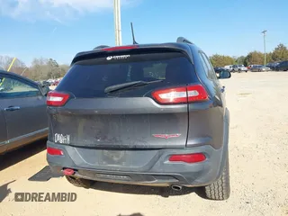 2014 Jeep Cherokee Trailhawk with VIN 1C4PJMBS6EW278987, listed as a IAAI auction lot 41789868 with 136,696 mi miles. Bid and sale history available at carsss.com. Image 17.