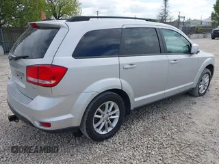 2014 Dodge Journey SXT with VIN 3C4PDCBG9ET209357, listed as a IAAI auction lot 42257467 with 121,786 mi miles and . Bid and sale history available at DreamBid. Image 4.