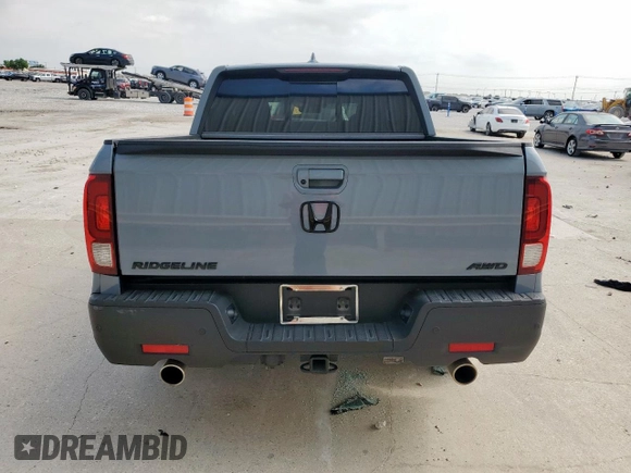 2023 Honda Ridgeline RTL-E with VIN 5FPYK3F76PB036572, listed as a Copart auction lot 54717085 with 34,516 mi miles and Salvage title. Bid and sale history available at DreamBid. Image 6.
