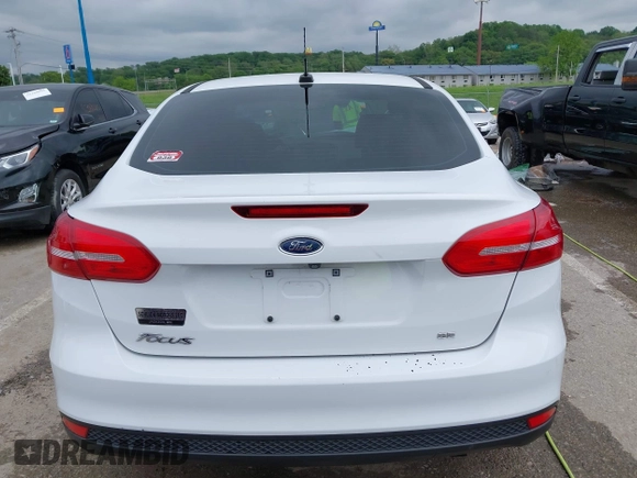 2018 Ford Focus SE z VIN 1FADP3F21JL257262, wystawiony jako IAAI lot #42174952 z przebiegiem 138 872 mil mil oraz . Historia ofert i sprzedaży dostępna na DreamBid. Obrazek 17.