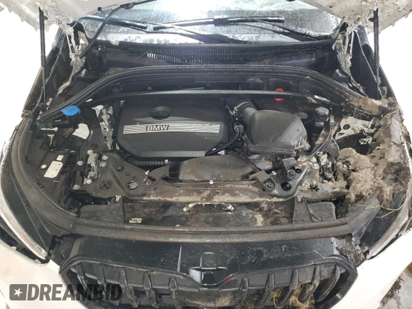 2023 BMW X1 xDrive28i with VIN WBX73EF08P5X60980, listed as a Copart auction lot 59899385 with 21,975 mi miles and Salvage title. Bid and sale history available at DreamBid. Image 12.