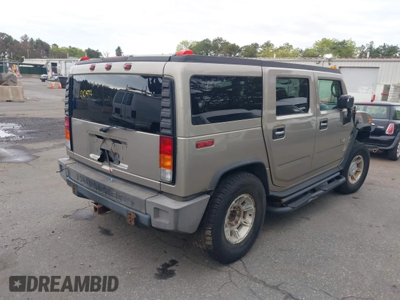 2003 Hummer H2 with VIN 5GRGN23U73H142389, listed as a IAAI auction lot 42219627 with 78,547 mi miles. Bid and sale history available at carsss.com. Image 4.