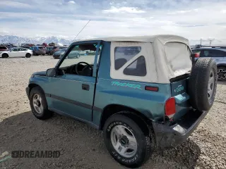 1996 Chevrolet Tracker z VIN 2CNBJ1869T6903615, wystawiony jako Copart lot #49690055 z przebiegiem 144 821 mil mil oraz Szkoda całkowita • Salvage title. Historia ofert i sprzedaży dostępna na DreamBid. Obrazek 2.
