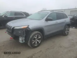 2014 Jeep Cherokee Trailhawk with VIN 1C4PJMBS1EW240177, listed as a Copart auction lot 43321715 with 212,339 mi miles and Salvage title. Bid and sale history available at DreamBid. Image 1.