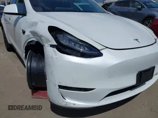 2020 Tesla Model Y Long Range with VIN 5YJYGDEE2LF058515, listed as a IAAI auction lot 41932748 with 62,885 mi miles and . Bid and sale history available at DreamBid. Image 20.