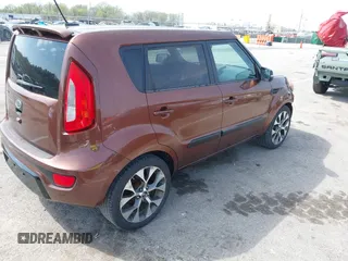 2012 Kia Soul + with VIN KNDJT2A63C7422074, listed as a IAAI auction lot 41911029 with 112,125 mi miles. Bid and sale history available at carsss.com. Image 4.