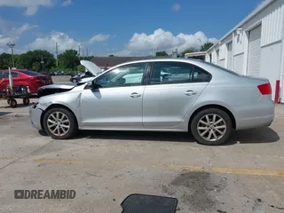 2012 Volkswagen Jetta Sedan SE w/Convenience with VIN 3VWDX7AJ1CM401939, listed as a IAAI auction lot 41941070 with 123,611 mi miles. Bid and sale history available at carsss.com. Image 14.