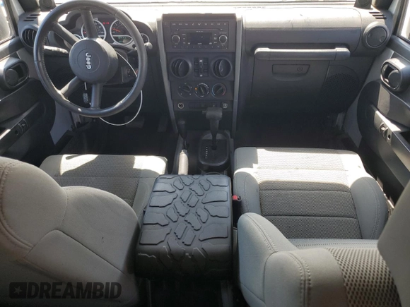 2007 Jeep Wrangler Unlimited Sahara with VIN 1J8GA59137L181360, listed as a Copart auction lot 62311225 with 151,393 mi miles and Salvage title. Bid and sale history available at DreamBid. Image 8.