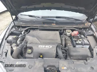 2015 Ford Taurus SHO with VIN 1FAHP2KT7FG148444, listed as a IAAI auction lot 40788614 with 121,533 mi miles and . Bid and sale history available at DreamBid. Image 10.