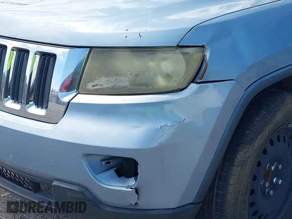 2013 Jeep Grand Cherokee Laredo with VIN 1C4RJEAG2DC517303, listed as a IAAI auction lot 42040405 with 222,952 mi miles. Bid and sale history available at carsss.com. Image 6.
