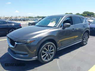 2018 Mazda CX-5 Grand Touring with VIN JM3KFADM8J1310328, listed as a IAAI auction lot 42322780 with 106,378 mi miles and . Bid and sale history available at DreamBid. Image 18.