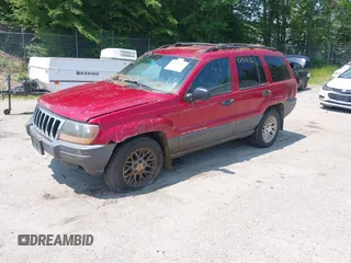 2001 Jeep Grand Cherokee Laredo z VIN 1J4GW48S11C720055, wystawiony jako IAAI lot #42453532 z przebiegiem 158 486 mil mil oraz . Historia ofert i sprzedaży dostępna na DreamBid. Obrazek 2.
