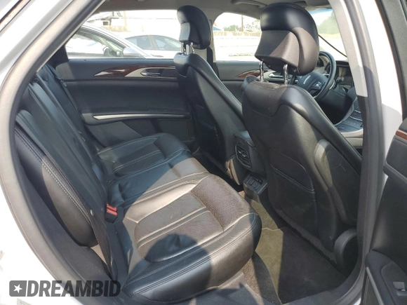 2015 Lincoln MKZ z VIN 3LN6L2GK9FR622783, wystawiony jako Copart lot #59892995 z przebiegiem 174 209 mil mil oraz Szkoda całkowita • Salvage title. Historia ofert i sprzedaży dostępna na DreamBid. Obrazek 10.