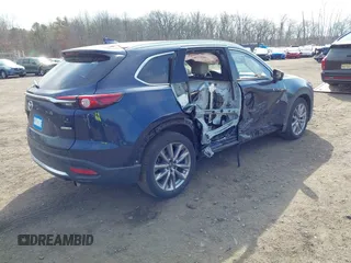 2021 Mazda CX-9 Grand Touring with VIN JM3TCBDY7M0540359, listed as a IAAI auction lot 41711366 with 47,391 mi miles and . Bid and sale history available at carsss.com. Image 4.