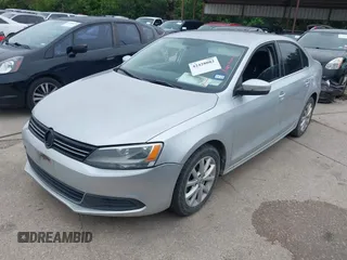 2014 Volkswagen Jetta SE with VIN 3VWD07AJ0EM239714, listed as a IAAI auction lot 42428082 with 124,221 mi miles and . Bid and sale history available at DreamBid. Image 2.