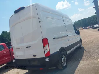 2023 Ford Transit Cargo with VIN 1FTBR2X81PKB38408, listed as a IAAI auction lot 42608271 with 28,384 mi miles and . Bid and sale history available at DreamBid. Image 4.