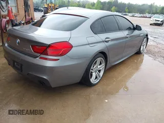2016 BMW 6 Series 640i xDrive with VIN WBA6D2C58GGT66160, listed as a IAAI auction lot 41130666 with 102,064 mi miles and . Bid and sale history available at carsss.com. Image 4.
