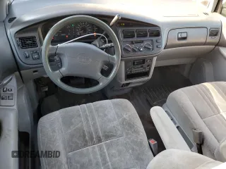 1999 Toyota Sienna LE with VIN 4T3ZF13C8XU108650, listed as a Copart auction lot 74476004 with 215,060 mi miles and Salvage Title. Bid and sale history available at carsss.com. Image 8.