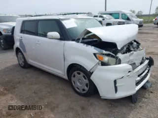 2012 Scion xB with VIN JTLZE4FE4CJ004977, listed as a IAAI auction lot 42116864 with 119,206 mi miles. Bid and sale history available at carsss.com. Image 1.
