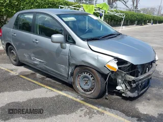 2009 Nissan Versa 1.8 S with VIN 3N1BC11EX9L468241, listed as a IAAI auction lot 42028204 with 153,806 mi miles. Bid and sale history available at carsss.com. Image 1.