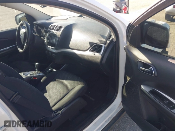 2015 Dodge Journey SE z VIN 3C4PDCAB4FT600293, wystawiony jako IAAI lot #41981386 z przebiegiem 143 573 mil mil oraz . Historia ofert i sprzedaży dostępna na DreamBid. Obrazek 5.