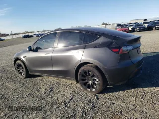 2024 Tesla Model Y Long Range with VIN 7SAYGDEE8RF002655, listed as a Copart auction lot 46422325 with 7,943 mi miles and Salvage Title. Bid and sale history available at DreamBid. Image 2.