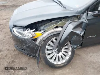 2015 Ford Fusion SE Hybrid with VIN 3FA6P0LU0FR242452, listed as a IAAI auction lot 41790218 with 163,741 mi miles. Bid and sale history available at carsss.com. Image 6.