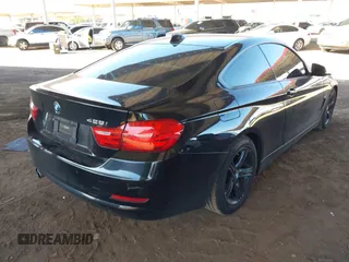 2015 BMW 4 Series 428i with VIN WBA3N3C55FK232613, listed as a IAAI auction lot 41865898 with 104,585 mi miles and . Bid and sale history available at carsss.com. Image 4.