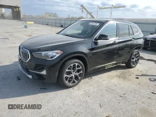 2020 BMW X1 xDrive28i with VIN WBXJG9C06L5P89796, listed as a Copart auction lot 52817235 with 95,665 mi miles and Salvage title. Bid and sale history available at DreamBid. Image 1.