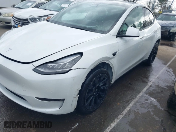 2022 Tesla Model Y Long Range with VIN 7SAYGDEE6NF461788, listed as a IAAI auction lot 41697064 with 34,034 mi miles and . Bid and sale history available at carsss.com. Image 6.