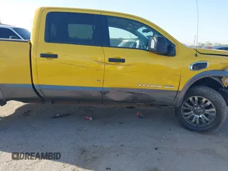 2016 Nissan Titan SL z VIN 1N6BA1F48GN500066, wystawiony jako IAAI lot #41857911 z przebiegiem 133 303 mil mil oraz . Historia ofert i sprzedaży dostępna na DreamBid. Obrazek 13.