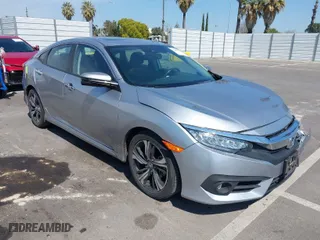 2017 Honda Civic Sedan Touring with VIN 2HGFC1F96HH657469, listed as a IAAI auction lot 41896184 with 72,315 mi miles. Bid and sale history available at carsss.com. Image 1.