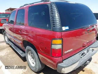 2004 GMC Yukon SLT with VIN 1GKEK13Z44R301456, listed as a IAAI auction lot 42056635 with 196,799 mi miles. Bid and sale history available at carsss.com. Image 3.
