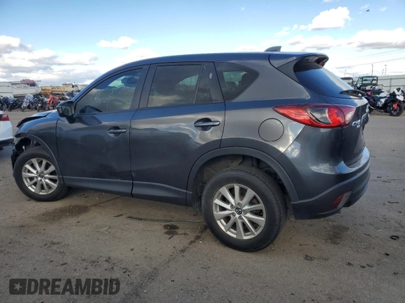 2015 Mazda CX-5 Sport with VIN JM3KE4BE0F0441203, listed as a Copart auction lot 79968514 with 134,890 mi miles and Salvage title. Bid and sale history available at DreamBid. Image 2.