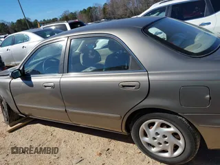 1999 Mazda 626 LX with VIN 1YVGF22D8X5871485, listed as a IAAI auction lot 41641049 with 115,603 mi miles. Bid and sale history available at carsss.com. Image 14.