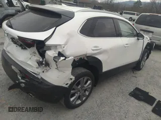 2021 Mazda CX-30 Premium with VIN 3MVDMADL5MM318729, listed as a IAAI auction lot 41645560 with 51,132 mi miles and . Bid and sale history available at DreamBid. Image 4.